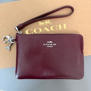 Coach Boxed Corner Zip Wristlet With Charms in Dark Wine Shiny Smooth Leather